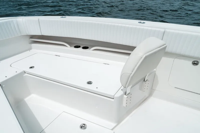  Yacht Photos Pics 2012 Jupiter 34 FS boat interior with white seating and storage, on water.