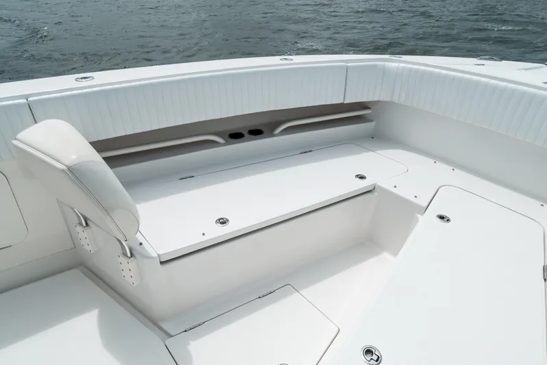  Yacht Photos Pics 2012 Jupiter 34 FS boat interior with white seating and storage compartments.