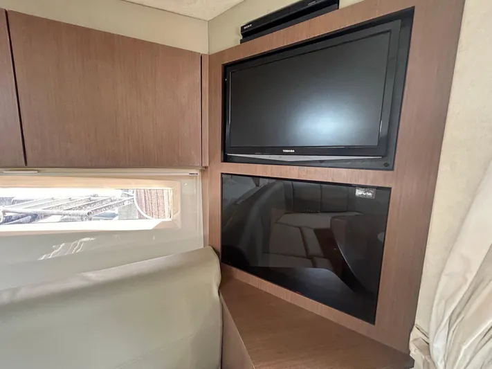 Mr Bojangles Yacht Photos Pics 2014 Sea Ray 370 Venture interior with TV and cabinetry