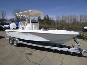 2024 Ranger 2360 Bay boat on trailer, white hull, parked outdoors.