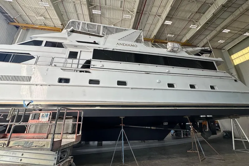 Andiamo Yacht Photos Pics Luxury yacht Broward 102, 1991 model, in a shipyard for maintenance.