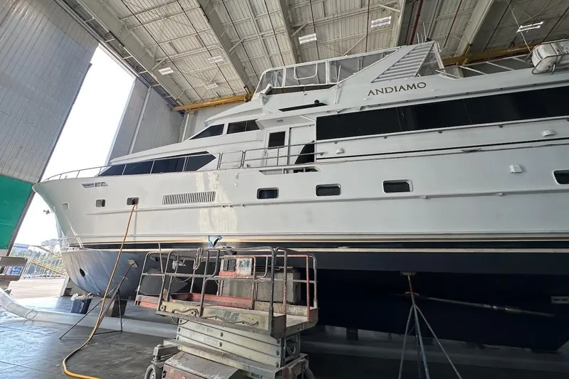 Andiamo Yacht Photos Pics Luxury yacht Broward 102, 1991 model, in a shipyard for maintenance.
