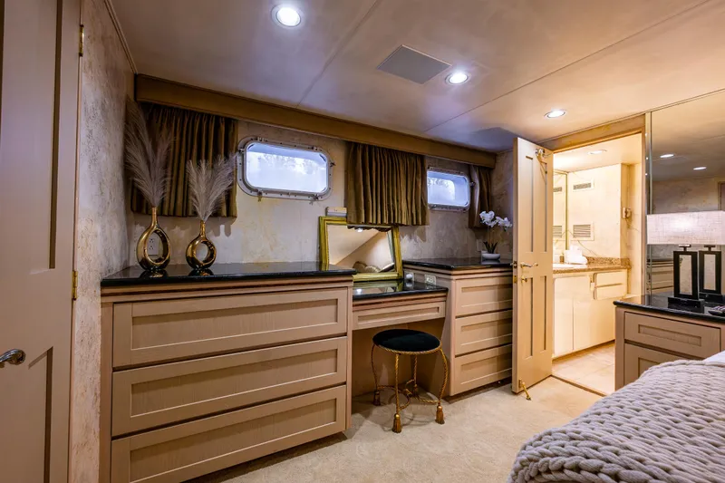 Andiamo Yacht Photos Pics Luxurious yacht interior with elegant vanity, Broward 102, 1991 model.