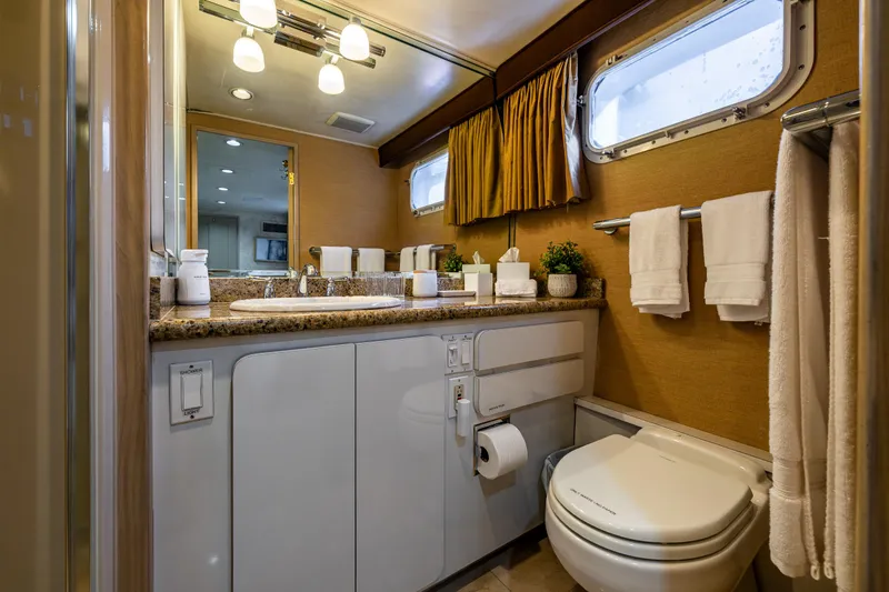Andiamo Yacht Photos Pics Luxurious yacht bathroom with modern fixtures, Broward 102, 1991 model.