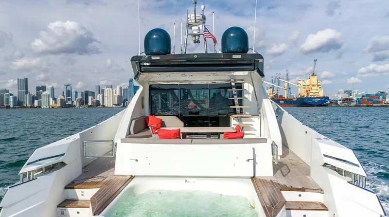  Yacht Photos Pics Luxury Numarine 78 yacht, 2019 model, cruising with city skyline and harbor in background.