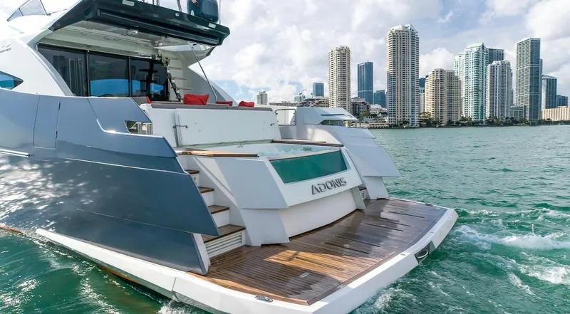  Yacht Photos Pics Luxury 2019 Numarine 78 yacht cruising near city skyline, featuring sleek design and spacious deck.