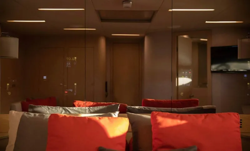  Yacht Photos Pics Luxurious interior of 2019 Numarine 78 yacht with modern decor and vibrant cushions.