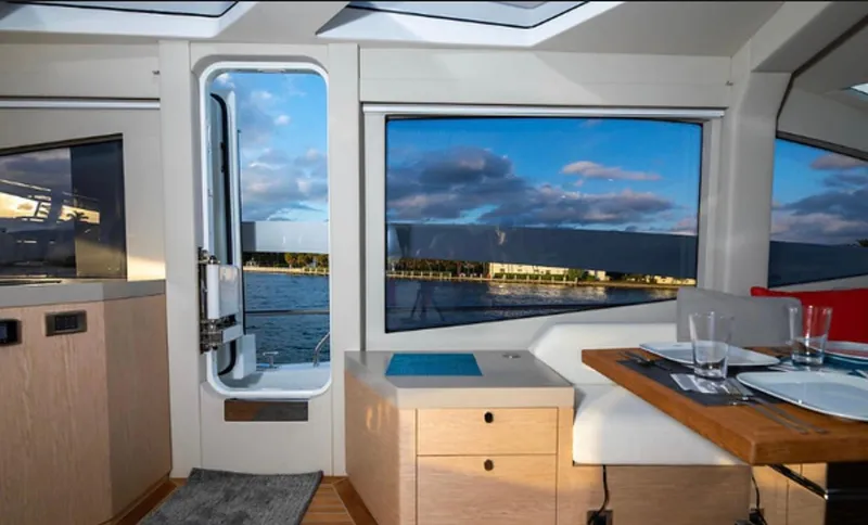  Yacht Photos Pics Interior of 2019 Numarine 78 yacht with scenic water view through large windows.