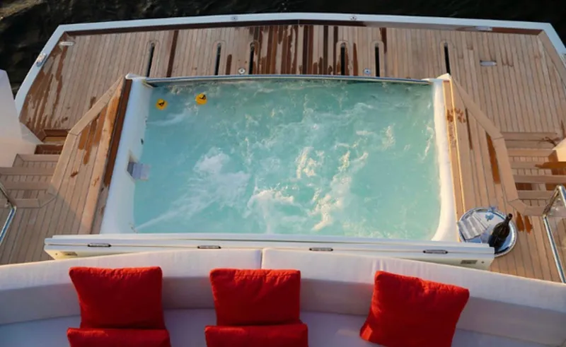  Yacht Photos Pics Luxurious 2019 Numarine 78 yacht deck with jacuzzi and red cushions.