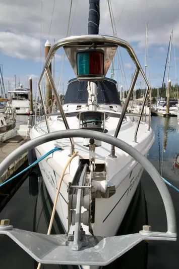 Yacht Photos Pics 2001 Hunter Passage 420 sailboat docked in marina, front view with anchor and navigation light.