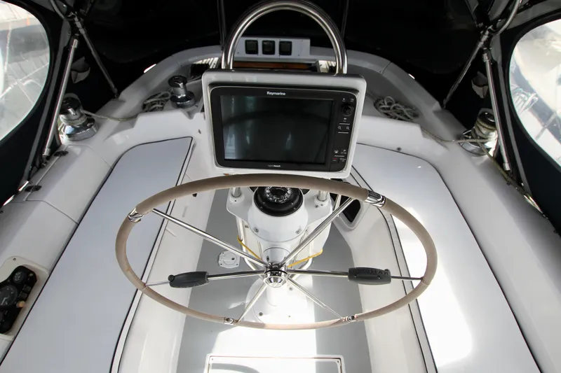  Yacht Photos Pics Steering wheel and navigation system on 2001 Hunter Passage 420 yacht.