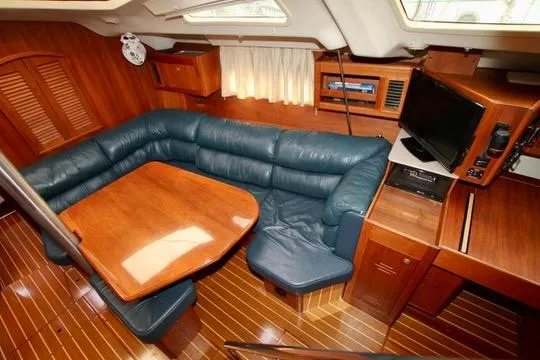  Yacht Photos Pics Interior of 2001 Hunter Passage 420 yacht with wood finish and blue seating.