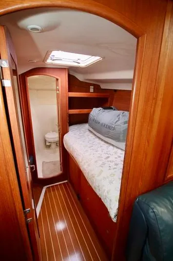  Yacht Photos Pics 2001 Hunter Passage 420 yacht interior with cozy cabin and wooden finish.