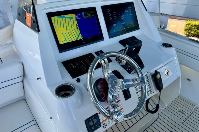  Yacht Photos Pics Helm of 2025 Intrepid 327 Cuddy with dual displays and modern controls.