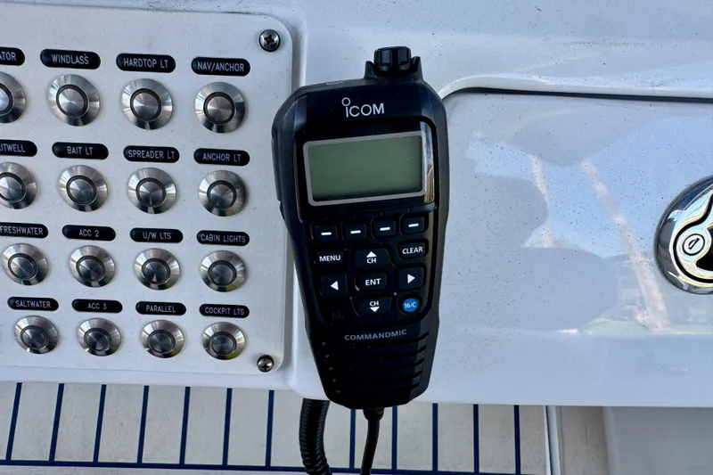  Yacht Photos Pics Control panel and radio on a 2025 Intrepid 327 Cuddy boat dashboard.