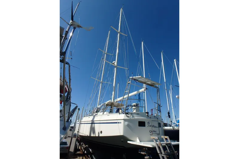 Si J'avais Su Yacht Photos Pics Custom Gilbert Caroff Lex Eterna 47 sailboat, 2017 model, docked under clear blue sky.
