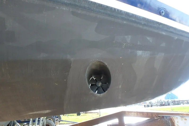 Si J'avais Su Yacht Photos Pics Close-up of 2017 Custom Gilbert Caroff Lex Eterna 47 boat hull with visible propeller.