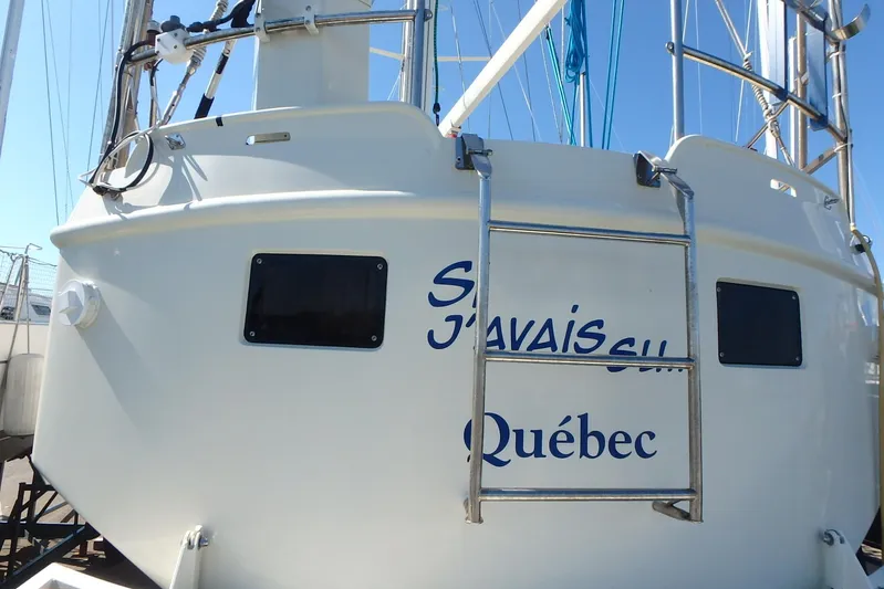 Si J'avais Su Yacht Photos Pics Custom Gilbert Caroff Lex Eterna 47 sailboat, 2017, with ladder and Qu&eacute;bec text on stern.