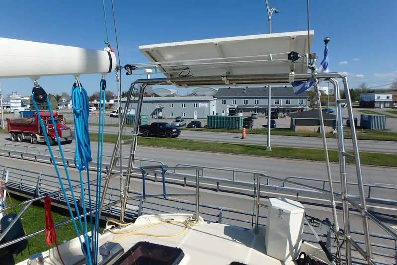 Si J'avais Su Yacht Photos Pics Custom Gilbert Caroff Lex Eterna 47 sailboat with solar panel, docked near a road, 2017 model.