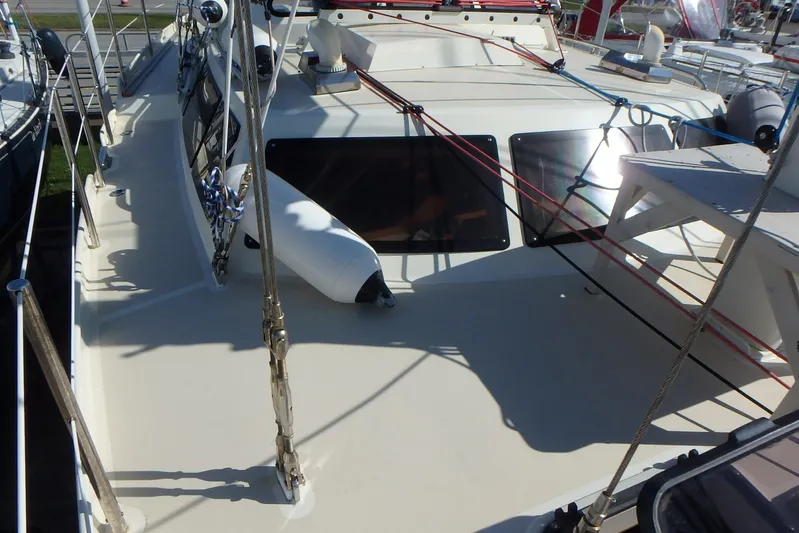 Si J'avais Su Yacht Photos Pics Deck view of 2017 Custom Gilbert Caroff Lex Eterna 47 sailboat with rigging and windows.