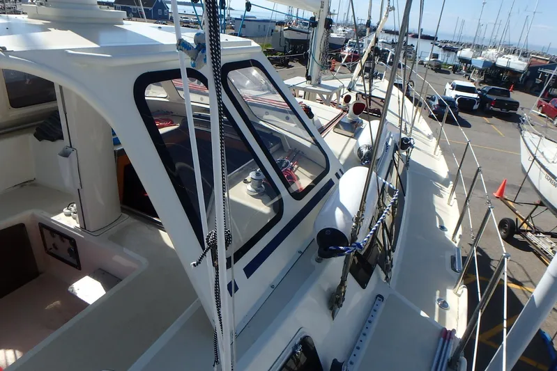 Si J'avais Su Yacht Photos Pics Custom 2017 Gilbert Caroff Lex Eterna 47 sailboat docked at marina, showcasing deck and cabin.