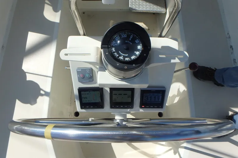 Si J'avais Su Yacht Photos Pics Steering console of 2017 Custom Gilbert Caroff Lex Eterna 47 with compass and navigation instruments.