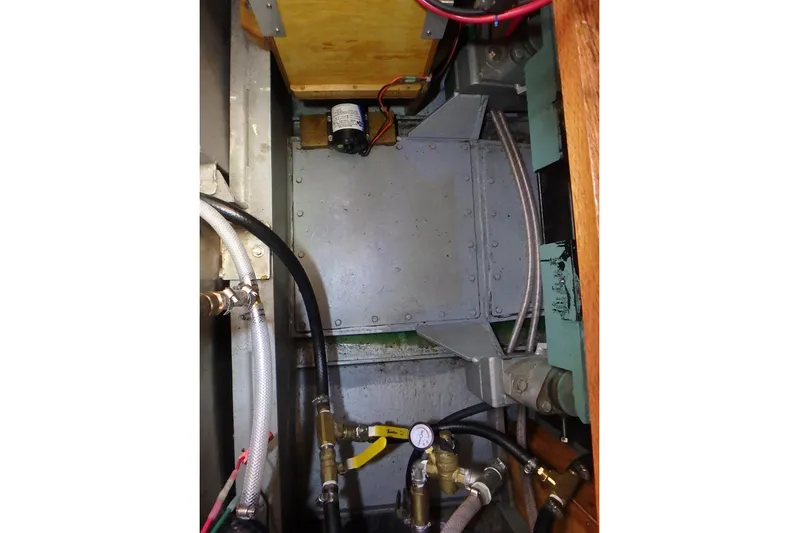 Si J'avais Su Yacht Photos Pics Engine compartment of 2017 Custom Gilbert Caroff Lex Eterna 47 with visible hoses and components.