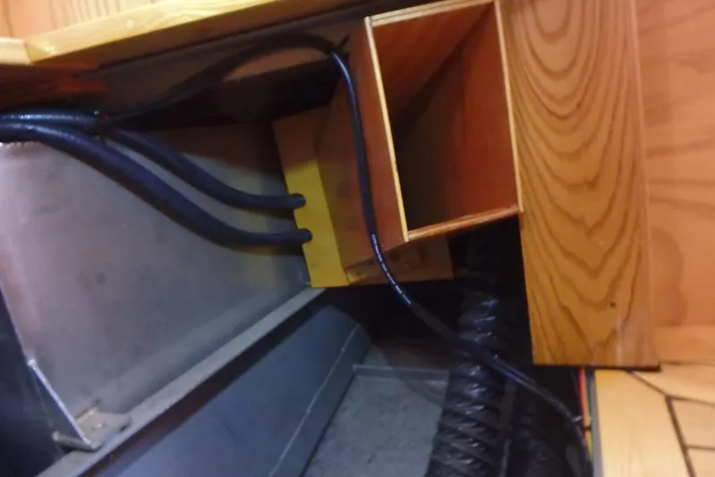 Si J'avais Su Yacht Photos Pics Interior view of 2017 Custom Gilbert Caroff Lex Eterna 47, showcasing wooden cabinetry and wiring.