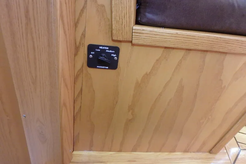 Si J'avais Su Yacht Photos Pics Wooden interior panel with Maradyne heater control on a 2017 Gilbert Caroff Lex Eterna 47.