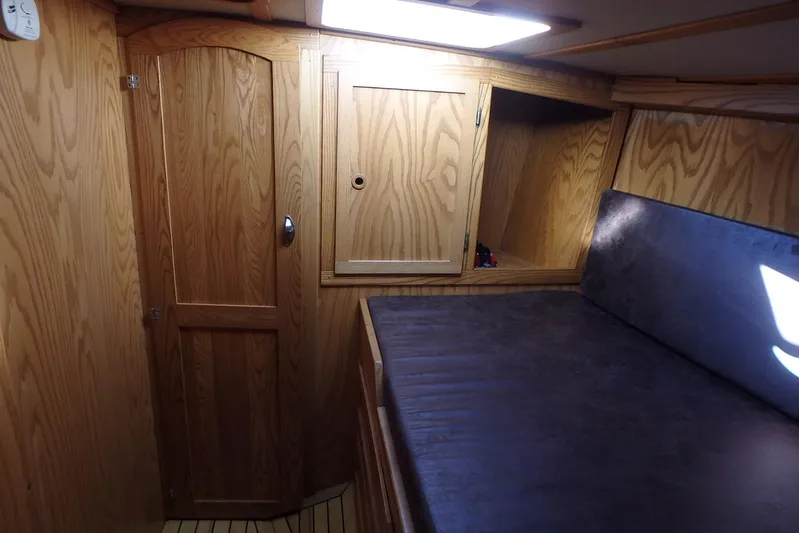 Si J'avais Su Yacht Photos Pics Wood-paneled cabin interior of 2017 Custom Gilbert Caroff Lex Eterna 47 yacht.