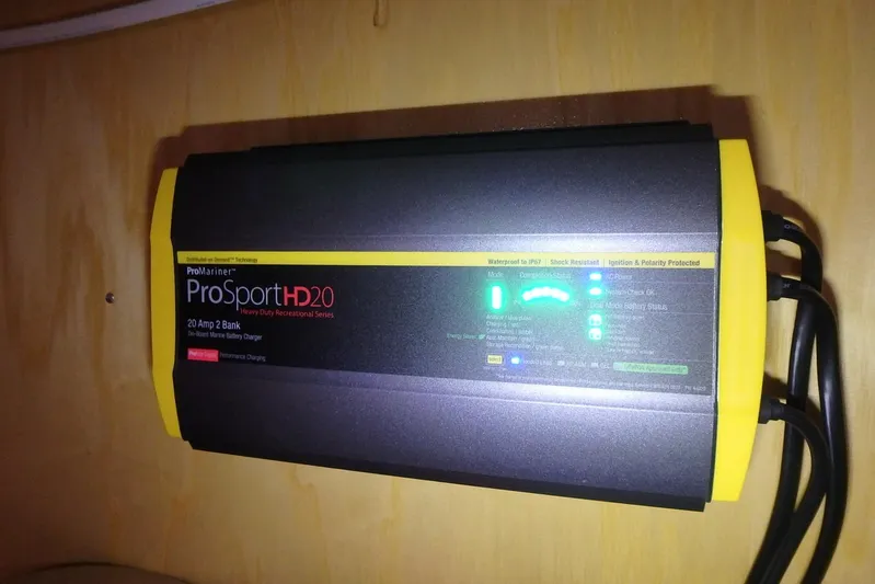 Si J'avais Su Yacht Photos Pics ProMariner ProSport HD20 marine battery charger mounted on a wooden surface.