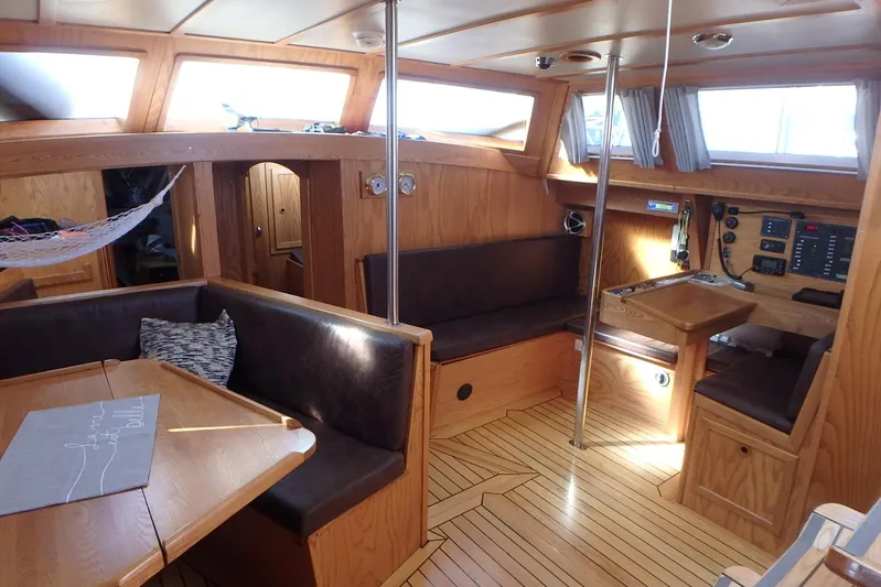 Si J'avais Su Yacht Photos Pics Interior of 2017 Custom Gilbert Caroff Lex Eterna 47 sailboat with wooden furnishings.
