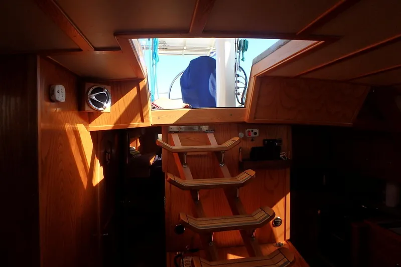 Si J'avais Su Yacht Photos Pics Interior of 2017 Custom Gilbert Caroff Lex Eterna 47 yacht with wooden stairs and hatch.