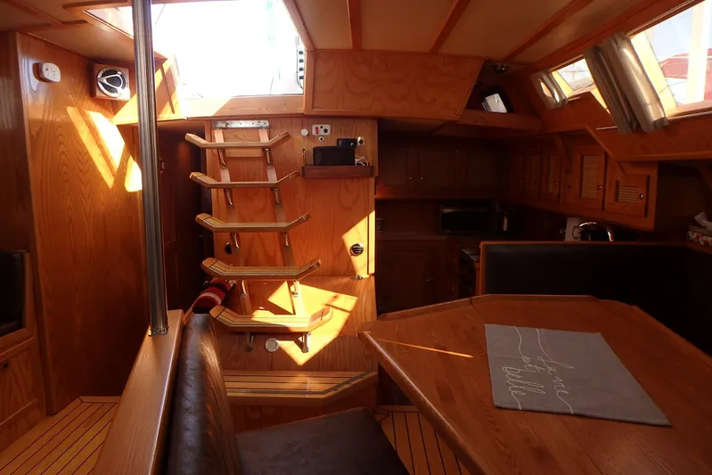 Si J'avais Su Yacht Photos Pics Interior of 2017 Custom Gilbert Caroff Lex Eterna 47 yacht with wooden furnishings.