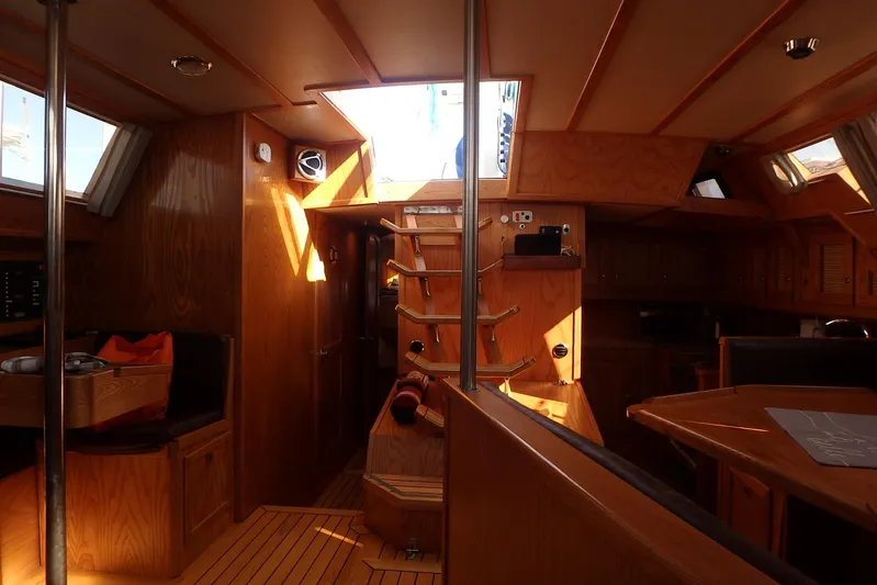 Si J'avais Su Yacht Photos Pics Interior of 2017 Custom Gilbert Caroff Lex Eterna 47 yacht with wooden finish and natural light.