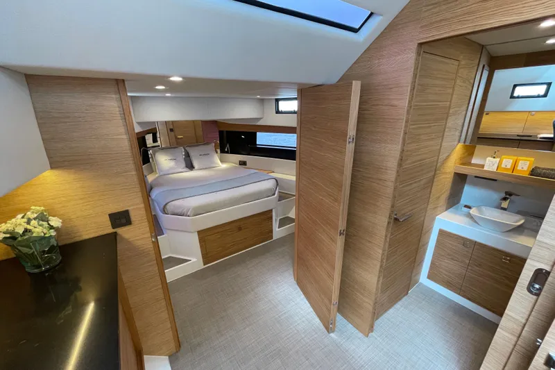  Yacht Photos Pics Luxurious interior of 2024 De Antonio Yachts D50, featuring modern bedroom and bathroom design.
