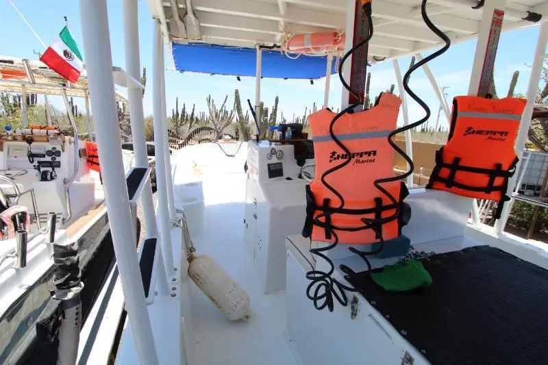  Yacht Photos Pics 2022 Grady-White Canyon 336 boat interior with safety gear and Mexican flag.