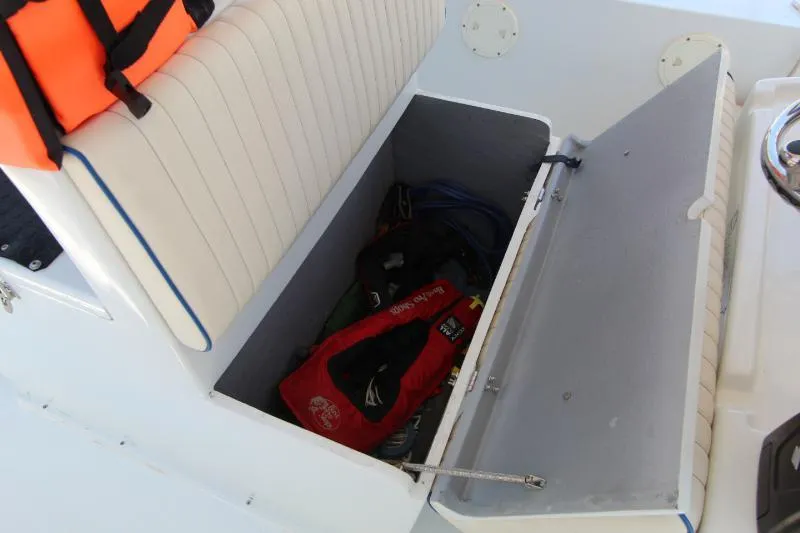  Yacht Photos Pics Storage compartment on 2022 Grady-White Canyon 336 boat with life jackets and gear.