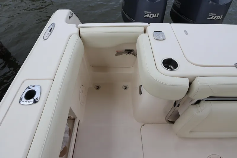  Yacht Photos Pics 2015 Grady-White Canyon 306 boat interior with seating and engine view.