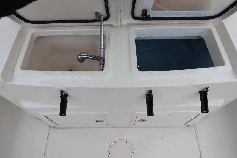  Yacht Photos Pics 2015 Grady-White Canyon 306 boat sink and storage compartments.