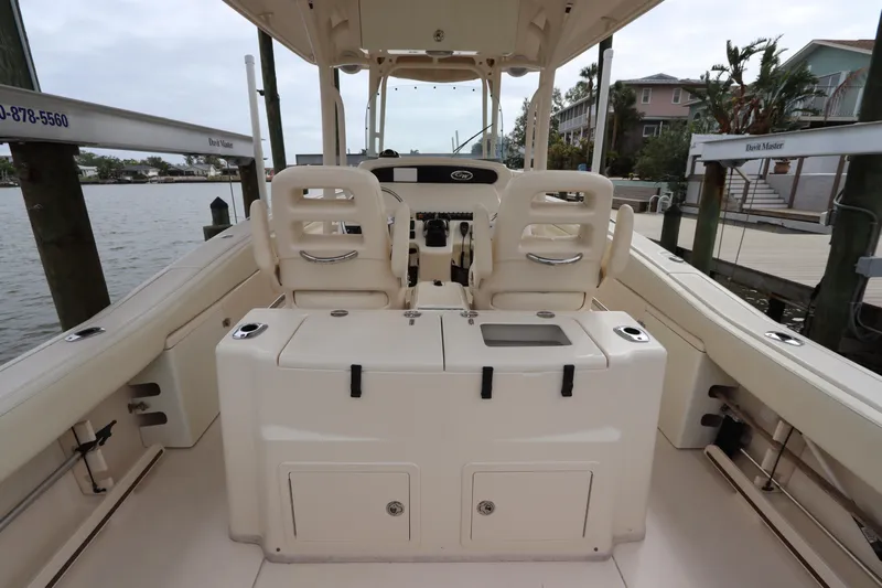  Yacht Photos Pics 2015 Grady-White Canyon 306 boat interior, featuring dual seats and storage compartments.
