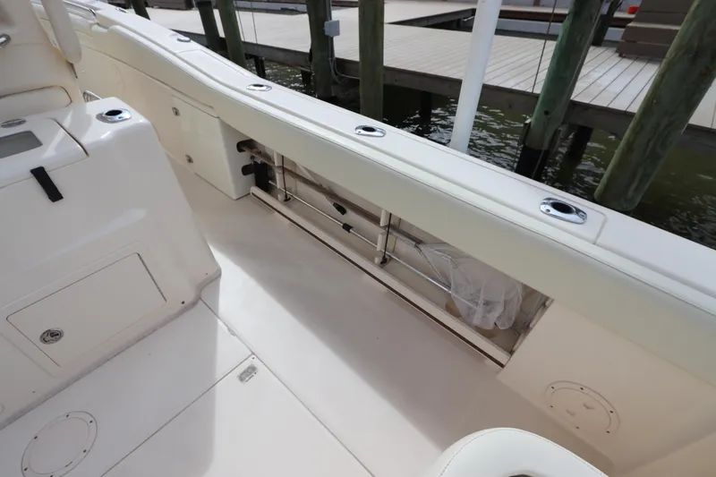  Yacht Photos Pics 2015 Grady-White Canyon 306 boat interior, featuring spacious deck and storage compartments.