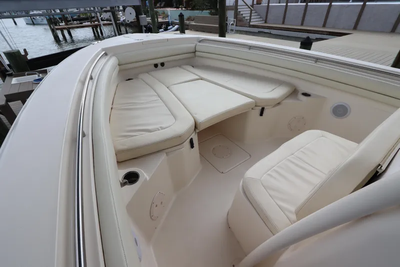  Yacht Photos Pics 2015 Grady-White Canyon 306 boat interior with cushioned seating and cup holders.