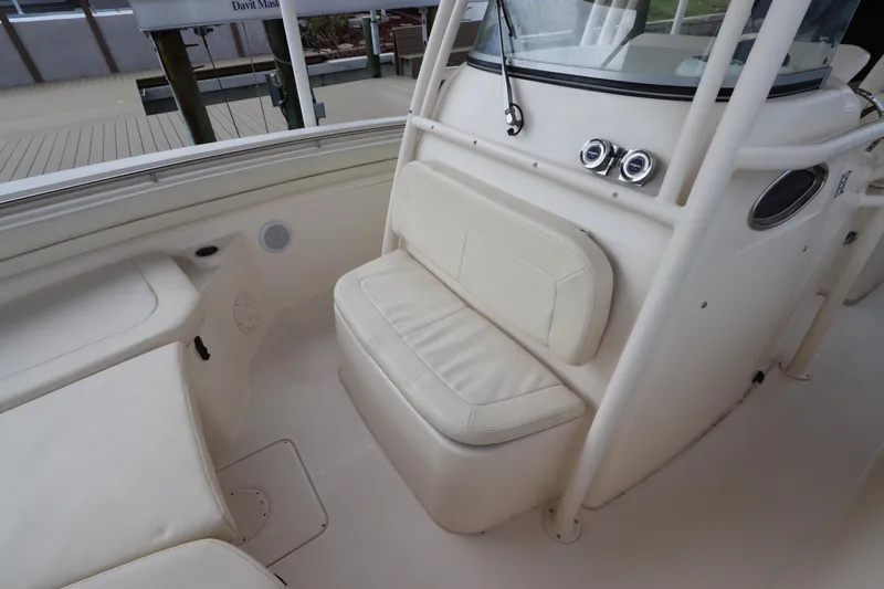  Yacht Photos Pics 2015 Grady-White Canyon 306 boat interior with cushioned seating and console.