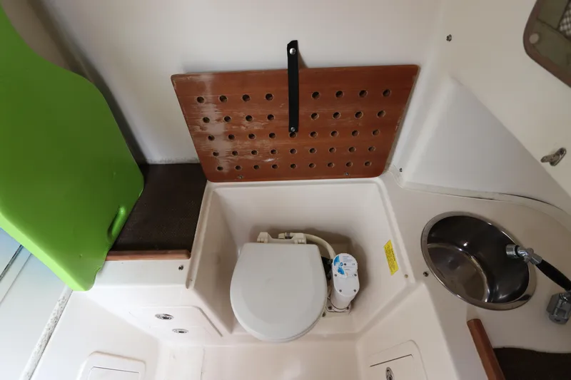  Yacht Photos Pics 2015 Grady-White Canyon 306 boat interior with toilet and sink.