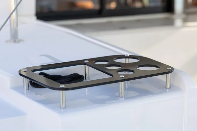 Aura Yacht Photos Pics Cup holder on 2024 Lagoon 46 yacht deck, featuring sleek metal design.