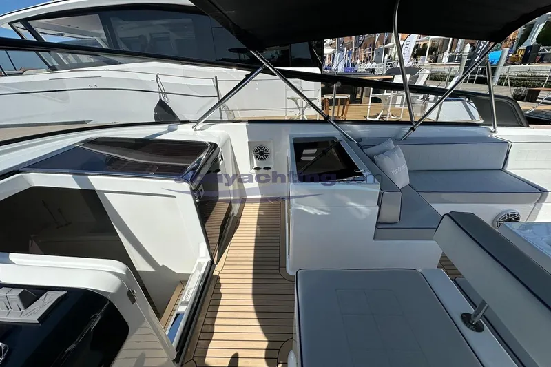  Yacht Photos Pics 2024 VanDutch 48 yacht interior with sleek design and modern seating area.