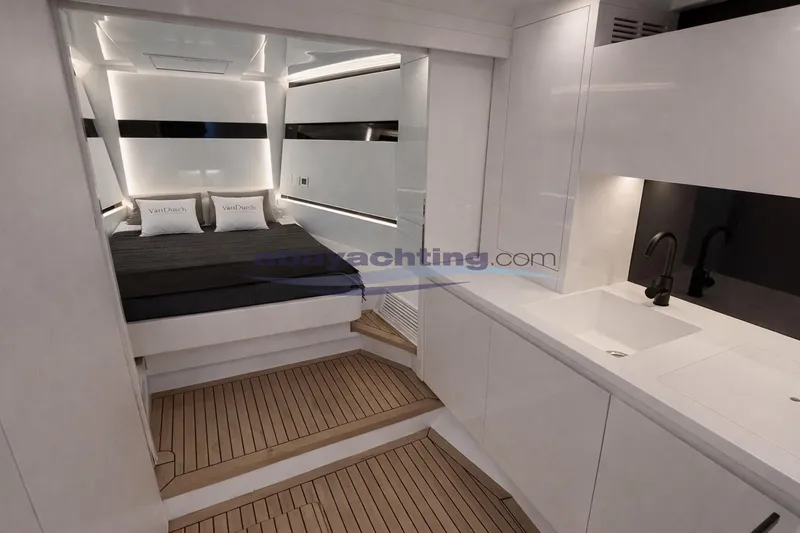  Yacht Photos Pics Luxurious interior of 2024 VanDutch 48 yacht with modern bedroom and sleek kitchenette.