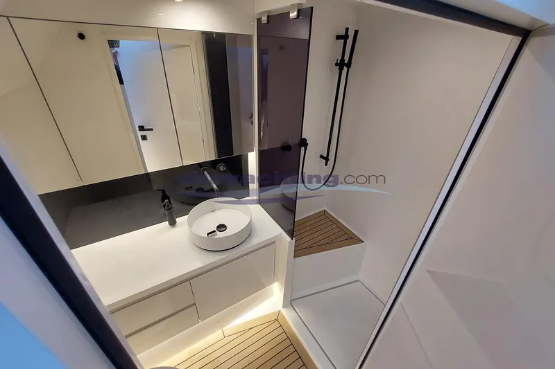  Yacht Photos Pics Luxurious bathroom interior of 2024 VanDutch 48 yacht with modern fixtures and elegant design.