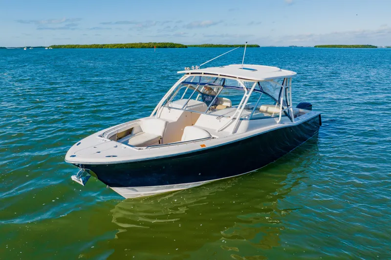  Yacht Photos Pics 2013 Grady-White Freedom 335 boat on calm blue water.